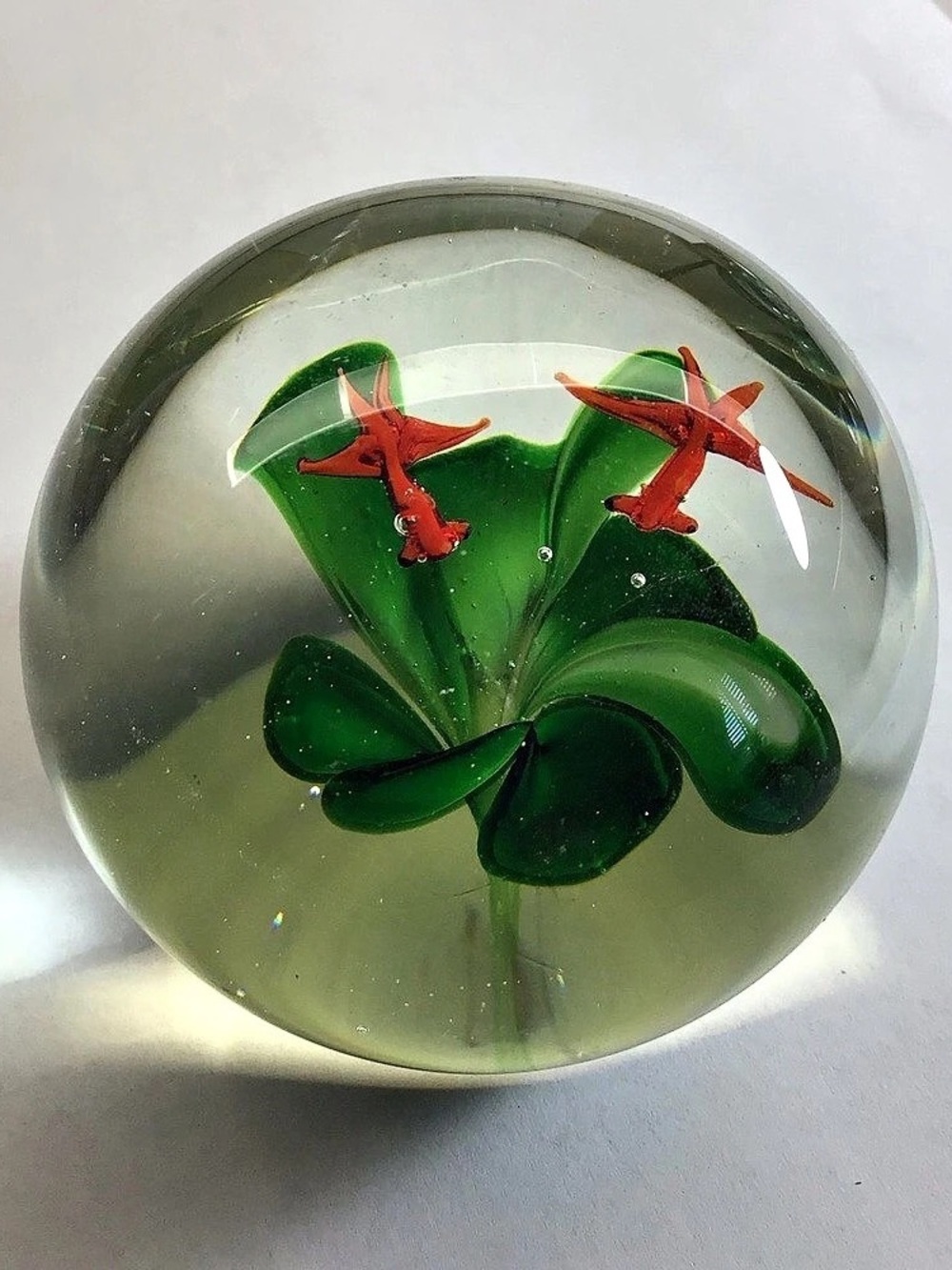 Vintage art, glass paperweight clear with green and orange floral ￼